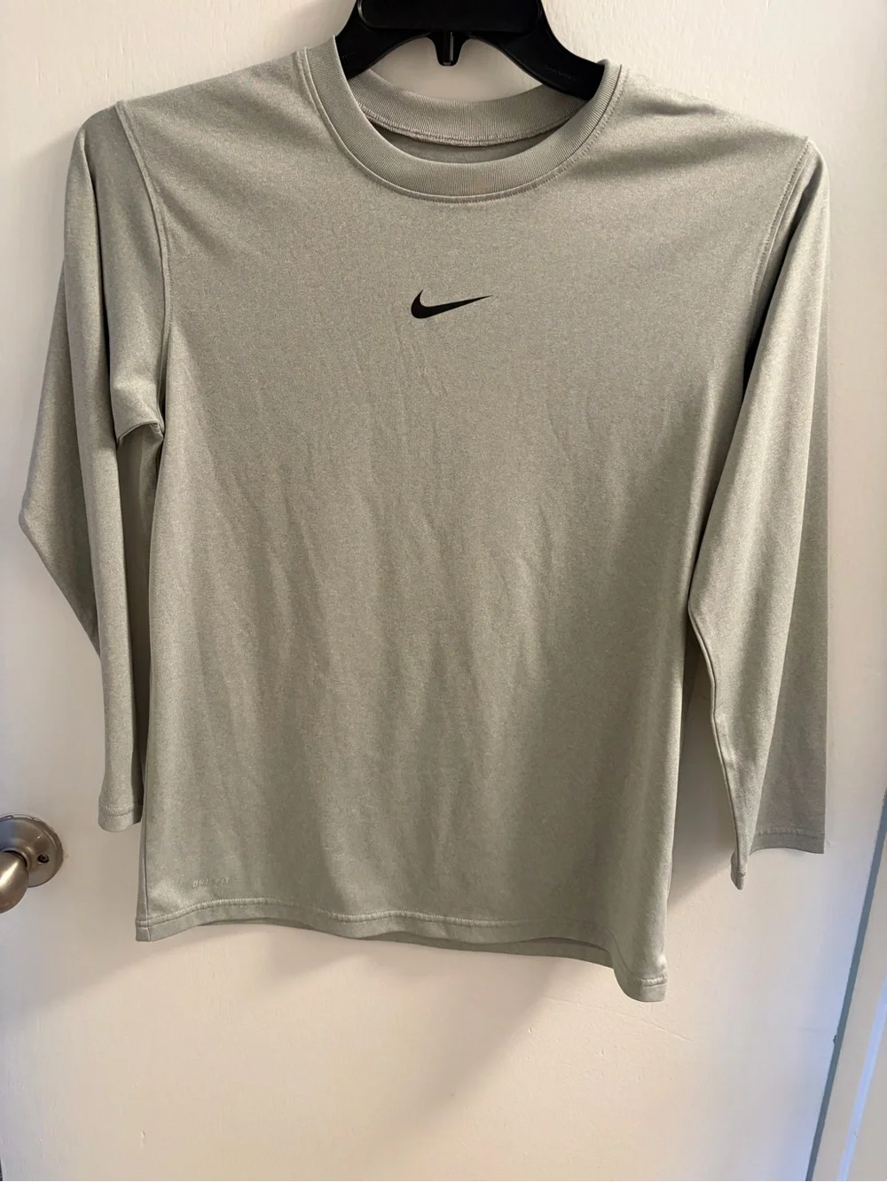 Nike Light Gray Long Sleeve Athletic Top with Black Swoosh